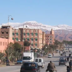 A panoramic view of Errachidia, showcasing the city's buildings with a backdrop of the rugged mountainous landscape