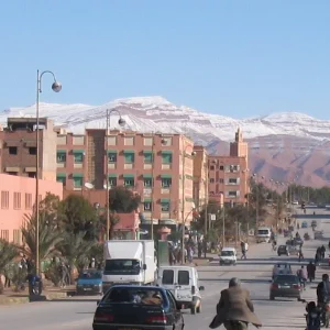 A panoramic view of Errachidia, showcasing the city's buildings with a backdrop of the rugged mountainous landscape