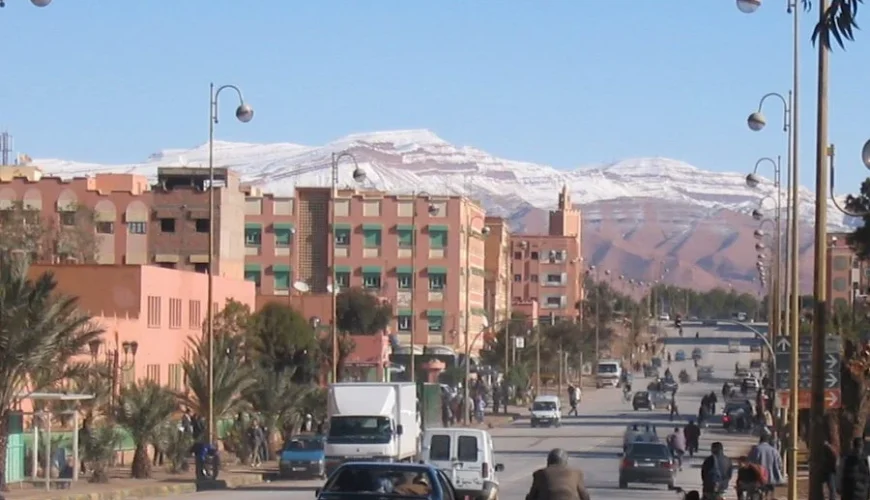 A panoramic view of Errachidia, showcasing the city's buildings with a backdrop of the rugged mountainous landscape