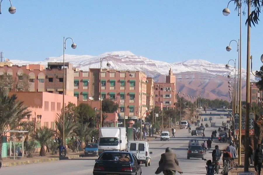 A panoramic view of Errachidia, showcasing the city's buildings with a backdrop of the rugged mountainous landscape